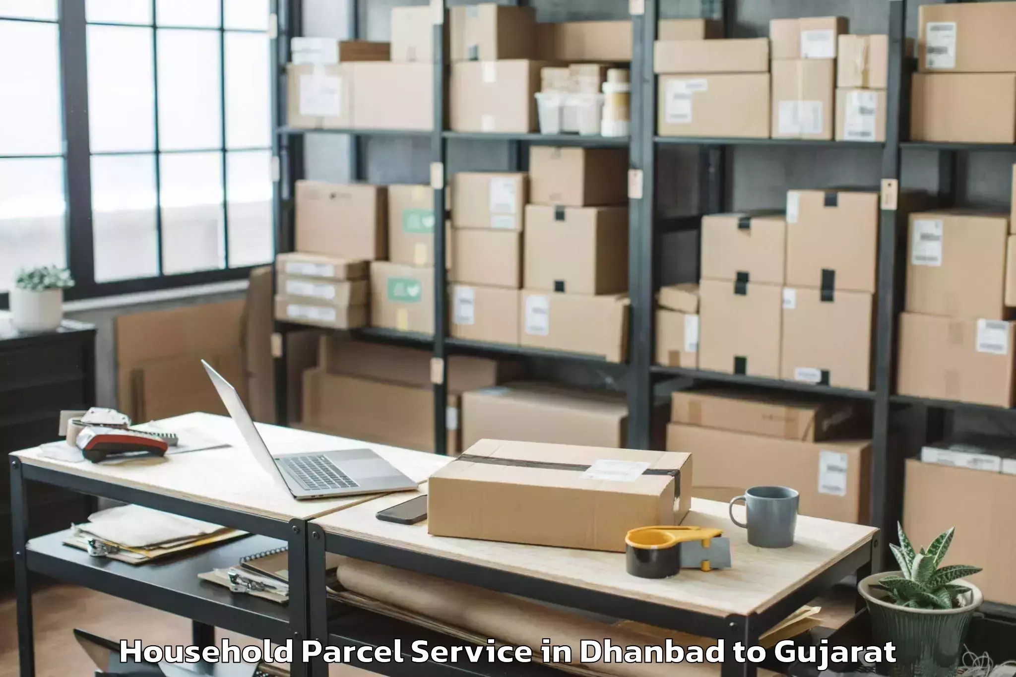 Book Your Dhanbad to Tilakwada Household Parcel Today